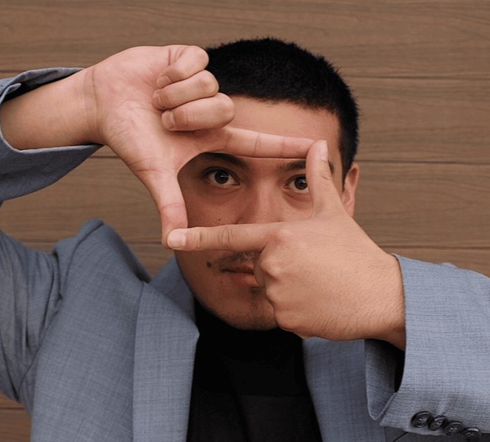 Man framing his eyes with hands